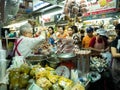 Vendor Woman Putting Food to Customers Waiting in The Market