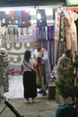 Vendors entice tourists to buy clothing and other souvenirs