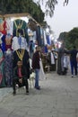 Vendors entice tourists to buy clothing and other souvenirs