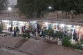 Vendors entice tourists to buy clothing and other souvenirs