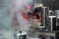 Vendors making fresh dumplings at the local street food