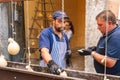 Vendors prepare caciocavallo cheese, called Impiccato, at the festival in Ospedaletto d\'Alpinolo near Avellino, Italy