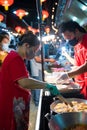 Vendors prepare food in the market