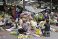 Vendors prepare the fresh flowers in front of the stall in Manila