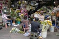 Vendors prepare the fresh flowers in front of the stall in Manila