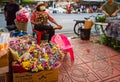 Vendors selling flowers on the sidewalk at Pak Khlong Talad market Chak Phet Road Bangkok Thailand