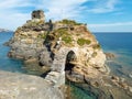 Venetian ancient Lower Castle at Andros island Chora, Cyclades Greece. Arched stone bridge over sea Royalty Free Stock Photo