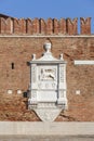 Venetian Arsenal, old shipyard, relief of Lion of Saint Mark on facade, Venice, Italy. Royalty Free Stock Photo