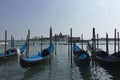 Venetian boats gondolas in harbor in Venice, Italy