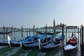 Venetian boats gondolas in harbor in Venice, Italy