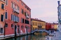 Venetian building at sunset time with lighting lights, boats and amazing sky over Grand canal. Royalty Free Stock Photo