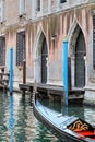 Venetian canal with boat passing Royalty Free Stock Photo