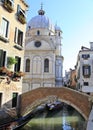 Venetian canal with the church of Santa Maria dei Miracoli in the background