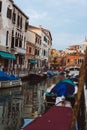 Venetian canals, old houses and moored boats