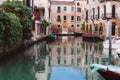 Venetian canals, old houses and moored boats