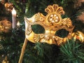 Venetian carnival mask on christmas tree. Christmas and New Year`s background. Christmas tree, ball, candle, mask Royalty Free Stock Photo