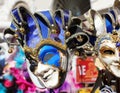 Venetian carnival masks for sale at a stall in Piazza San Marco during the festival Royalty Free Stock Photo