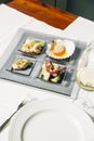 Venetian Cicchetti with shrimps, scallop, octopus and potatoes, and sea bass Royalty Free Stock Photo