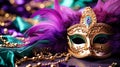 Venetian gold mask with beads and feather decoration in the traditional Mardi Gras colors of purple and green Royalty Free Stock Photo