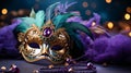 Venetian gold mask with beads and feather decoration in the traditional Mardi Gras colors of purple and green Royalty Free Stock Photo