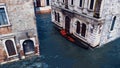 Venetian gondola on a canal in Venice Aerial view Royalty Free Stock Photo