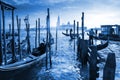 Venetian Gondolas in Italy, sunset behind San Giorgio Maggiore church. Classic Blue 2020 year color Royalty Free Stock Photo