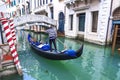 Venetian gondolier gondola through of Venice. Italy