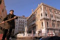 Venetian gondolier in his gondola on the Grand Canal, Venice, It