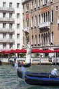 Venetian gondolier rowing through the Grand Canal, Statue of Liberty, Venice, Italy Royalty Free Stock Photo