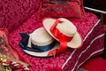 Venetian gondolier's red and blue hats on the sitting bench of a gondola, Venice, Italy