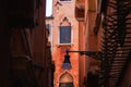 Venetian gothic style windows with wooden shutters of the narrow streets of Venice Royalty Free Stock Photo
