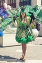 Venetian green costumes, beautiful girl parading in the street Royalty Free Stock Photo