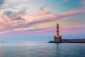 Venetian harbour and lighthouse in old harbour of Chania at sunset, Crete, Greece. Old venetian lighthouse in Chania, Greece. Royalty Free Stock Photo