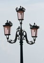 Venetian lamp post with pigeons Royalty Free Stock Photo