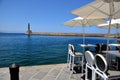 Venetian lighthouse and a restaurant of Chania harbour