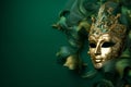 Venetian mask on a green background. Masquerade mardi gras concept. banner, greeting card Royalty Free Stock Photo