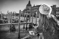 Venetian mask in hand of woman in Venice, Italy