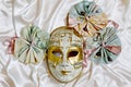 Venetian mask Volto and textile rosettes with ribbons