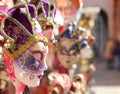 Venetian carnival masks for sale at a stall in Saint Mark Square during the festival Royalty Free Stock Photo