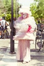 Venetian pink costumes, beautiful girl parading in the street