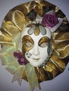 Venetian porcelain mask gold purple rose tear silver white fabric mask Royalty Free Stock Photo