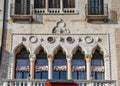 Venetian style windows on building facade. Royalty Free Stock Photo