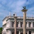 Venetian symbols of Saint Mark and Saint Theodore. The columns are installed on the square of St. Mark at the Doge`s Royalty Free Stock Photo