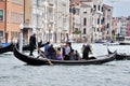 Venetians going to work in a gondola in Venice