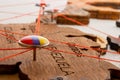 Venezuela flag on the pushpin and red threads on the wooden map