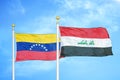 Venezuela and Iraq two flags on flagpoles and blue sky