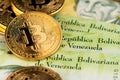 Bitcoin Cryptocurrency on Venezuela money Bolivar banknotes close up image. Royalty Free Stock Photo