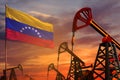 Venezuela oil industry concept. Industrial illustration - Venezuela flag and oil wells with the red and blue sunset or sunrise sky