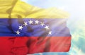 Venezuela waving flag against blue sky with sunrays