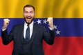 Venezuelan happy businessman on the background of flag of Venezuela Business, education, degree and citizenship concept